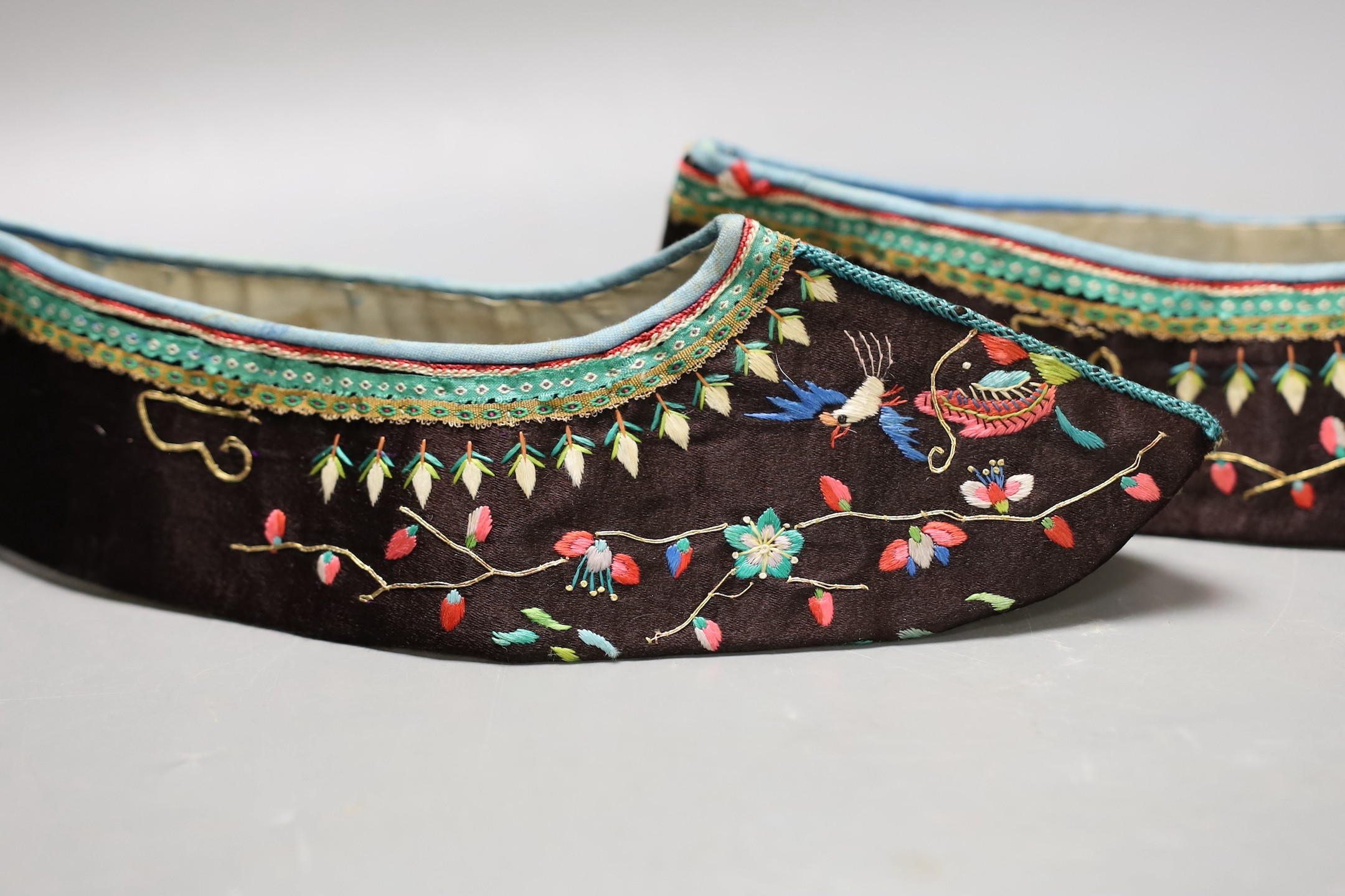 A pair of Chinese embroidered silk shoes, upper section only